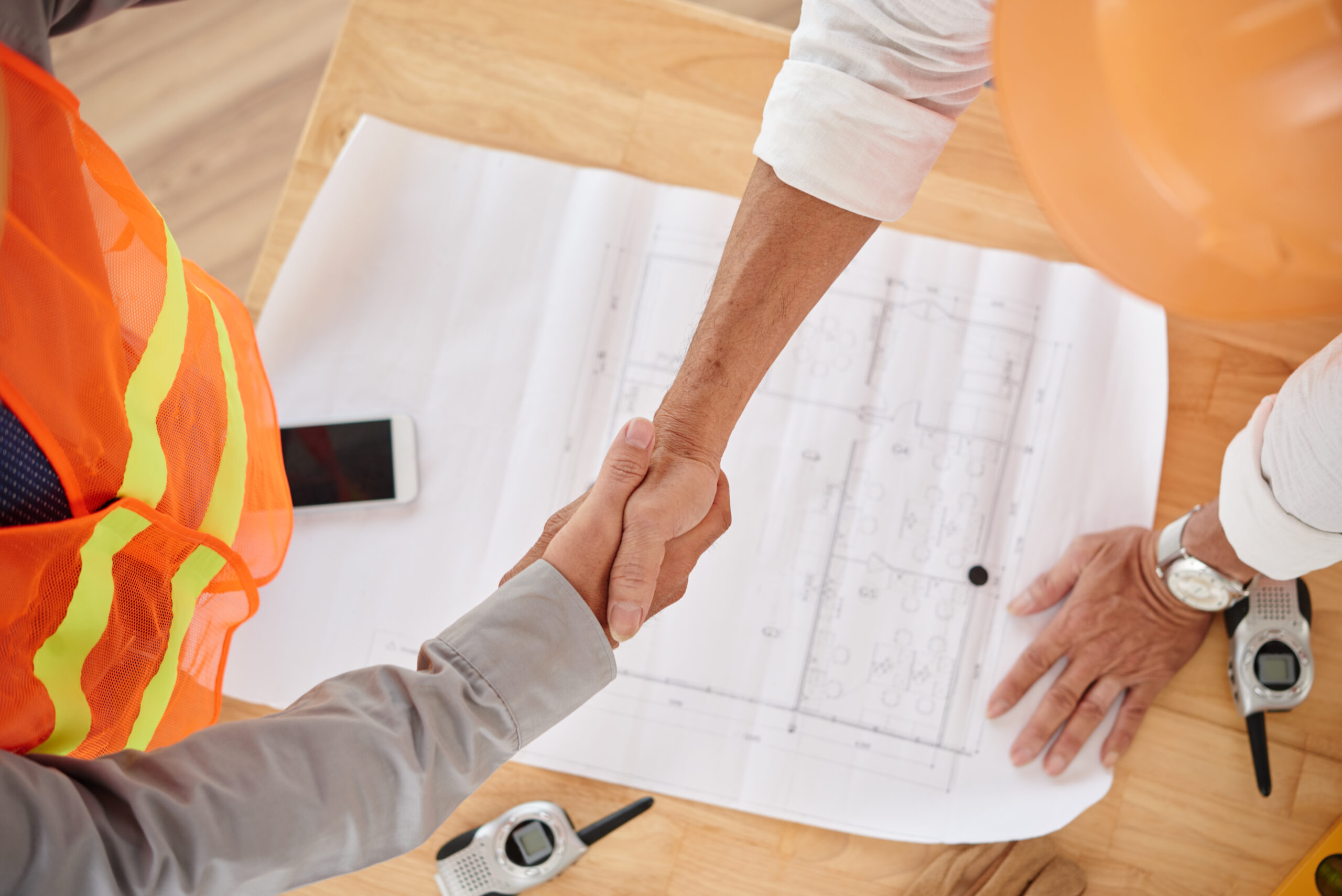 Building surveyor reviewing architectural plans